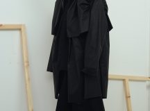 Jenna Rankin is a Masters Fashion Design graduate from The Glasgow School of Art. Her menswear collection draws inspiration from the relationship between clothing and wearer. She is particularly interested in the language of everyday dress, and the way in which we often wear clothing purely for practicality and function (for example; borrowing your Dad’s two-sizes-too-big coat to avoid the rain). Her research stems from explorations of the “uniform of the everyday” with a focus on exploring and subverting traditional ideas of function, scale and silhouette of these basic garments. Inspired by the characters she encountered on the street, and the archive of vintage and well-worn clothing she collected and photographed, the collection gives a nod to utilitarianism while simultaneously, and conflictingly, embracing notions of the excess and the impractical.