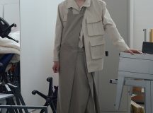 Jenna Rankin is a Masters Fashion Design graduate from The Glasgow School of Art. Her menswear collection draws inspiration from the relationship between clothing and wearer. She is particularly interested in the language of everyday dress, and the way in which we often wear clothing purely for practicality and function (for example; borrowing your Dad’s two-sizes-too-big coat to avoid the rain). Her research stems from explorations of the “uniform of the everyday” with a focus on exploring and subverting traditional ideas of function, scale and silhouette of these basic garments. Inspired by the characters she encountered on the street, and the archive of vintage and well-worn clothing she collected and photographed, the collection gives a nod to utilitarianism while simultaneously, and conflictingly, embracing notions of the excess and the impractical.
