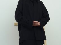 Jenna Rankin is a Masters Fashion Design graduate from The Glasgow School of Art. Her menswear collection draws inspiration from the relationship between clothing and wearer. She is particularly interested in the language of everyday dress, and the way in which we often wear clothing purely for practicality and function (for example; borrowing your Dad’s two-sizes-too-big coat to avoid the rain). Her research stems from explorations of the “uniform of the everyday” with a focus on exploring and subverting traditional ideas of function, scale and silhouette of these basic garments. Inspired by the characters she encountered on the street, and the archive of vintage and well-worn clothing she collected and photographed, the collection gives a nod to utilitarianism while simultaneously, and conflictingly, embracing notions of the excess and the impractical.
